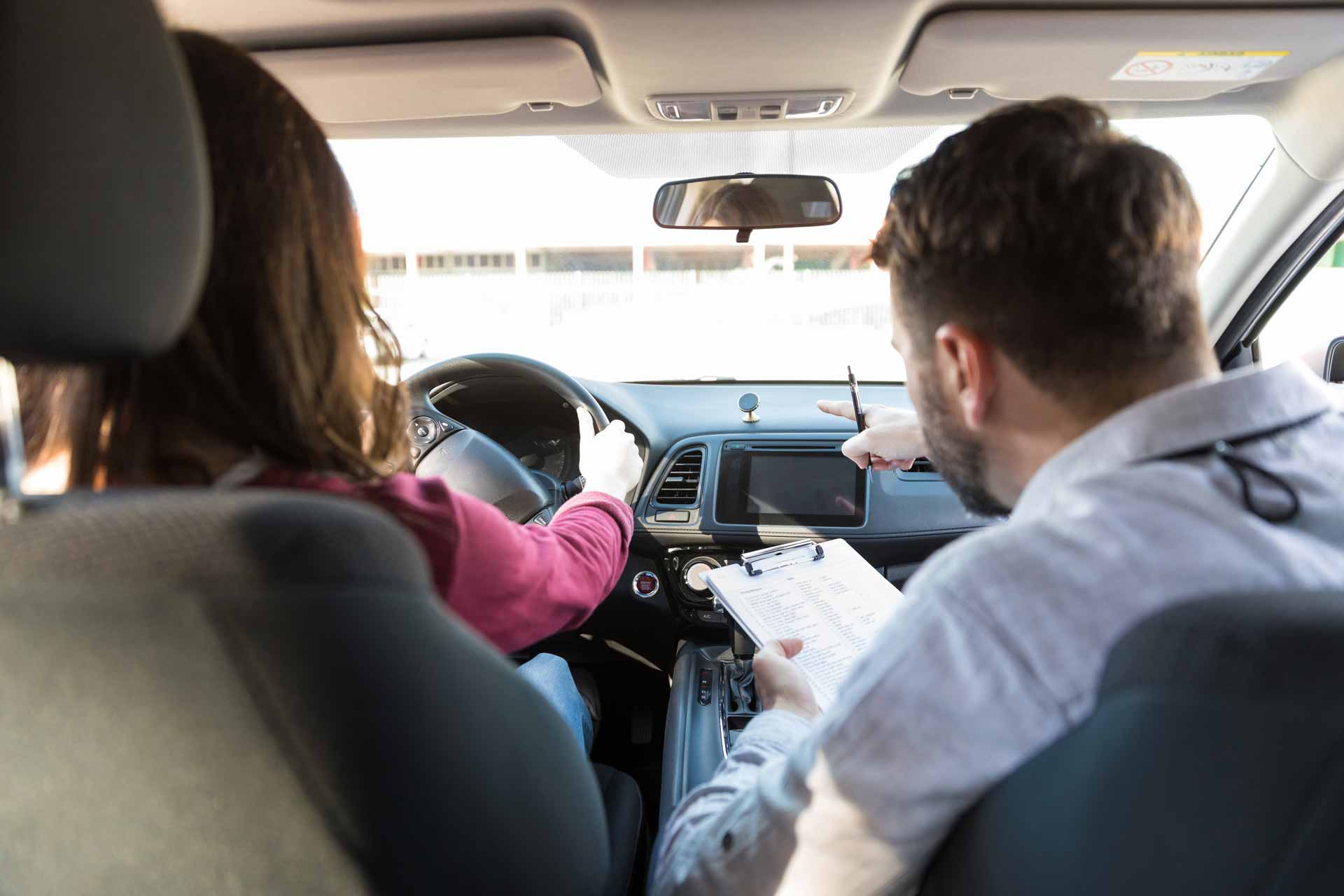 Professional driving instruction - student learning to drive with certified instructor