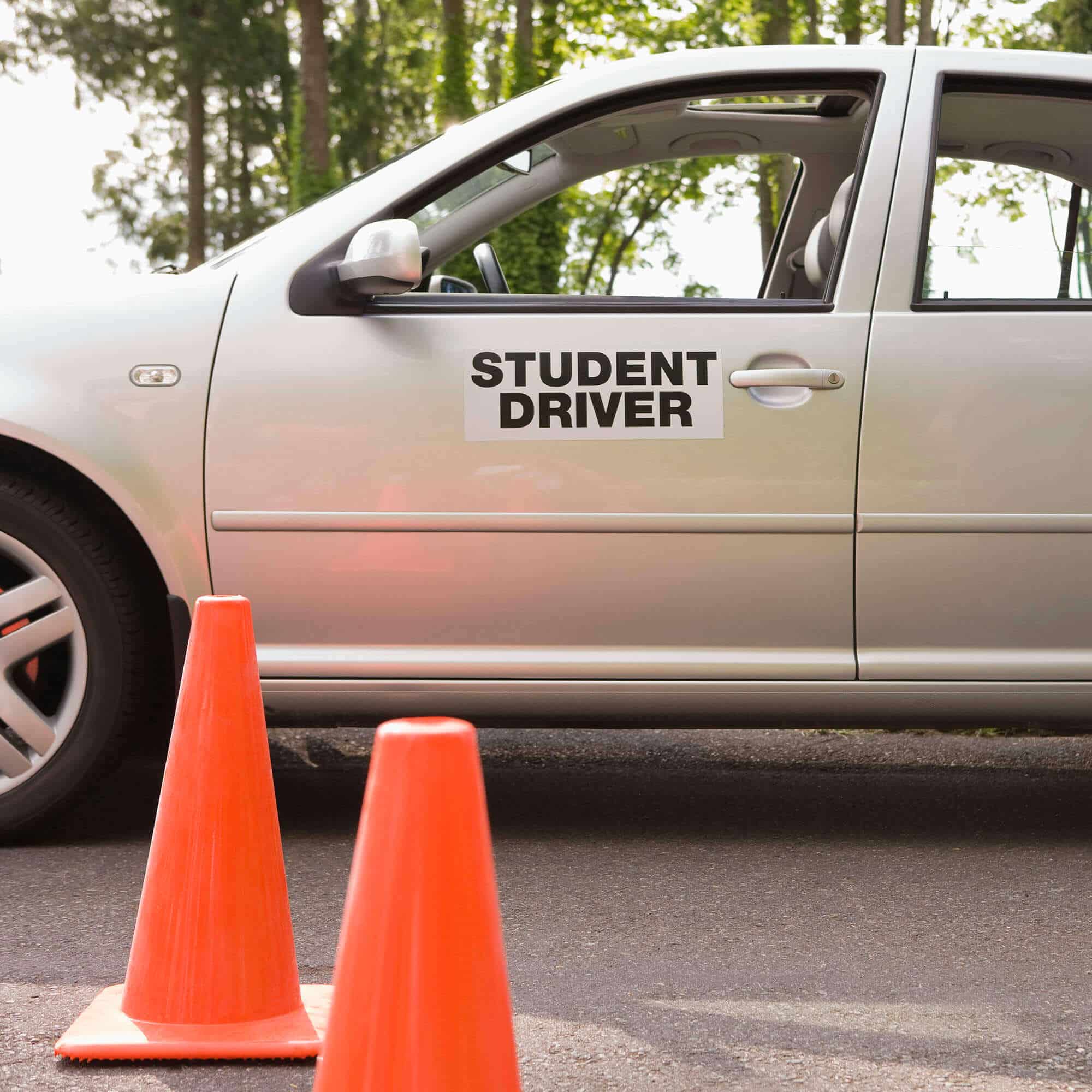 Student driver practicing with traffic cones